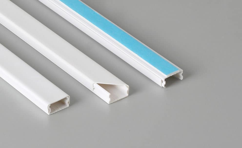 White PVC trunking bases and covers, including a blue adhesive liner